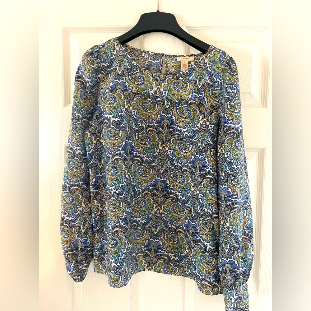 JCrew 100% silk blue paisley variation blouse with back button opening.